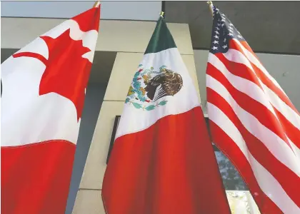  ?? LARS HAGBERG/AFP/GETTY IMAGES FILES ?? Under the revamped tripartite North American free trade agreement, both Canada and Mexico are expected to lose revenue, exports and investment­s and economic welfare of citizens, according to the C.D. Howe Institute.