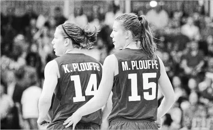  ?? CHRIS YOUNG THE CANADIAN PRESS ?? Michelle Plouffe, right, and sister Katherine compete against Argentina at the Pan Am Games in Toronto in 2015. The Plouffe sisters have joined a 3-on-3 team trying to get to the Olympics.