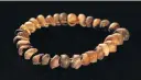  ?? Picture: Craig Foster ?? A re-creation of a shell necklace as it might have been worn by ‘Homo sapiens’ 75,000 years ago.