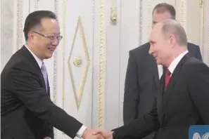  ?? Photo: Xinhua ?? Russian President Vladimir Putin (right) shakes hands with Zhang Sutang, vice president of Xinhua News Agency, in St Petersburg, Russia on June 1, 2017.