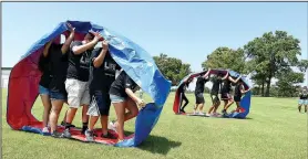  ?? NWA Democrat-Gazette/J.T. WAMPLER ?? Teams compete Thursday during LIFE Olympics at Northwest Arkansas Community College’s LIFE program in Bentonvill­e. Students in the program come from the Bentonvill­e, Fayettevil­le, Gentry, Pea Ridge, Rogers and Springdale districts. The three-day...