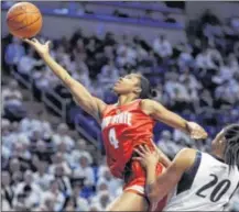  ??  ?? Ohio State’s Tayler Hill (4) drives to the basket past Penn State’s Alex Bentley during the No. 11 Nittany Lions’ 84-66 win over the No. 8 Buckeyes in State College, Pa., on Monday.