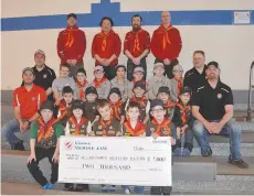  ??  ?? Members of Moose Jaw Scouting’s Beavers and Cubs troops accept a donation of $2,000 from the Moose Jaw Kinsmen prior to a water activities outing at the Kinsmen Sportsplex.