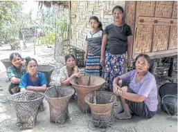  ??  ?? ETHNIC STRIFE: Women from the Myo ethnic group sit at Tinmay village in Buthidaung township in Myanmar’s northern Rakhine state.