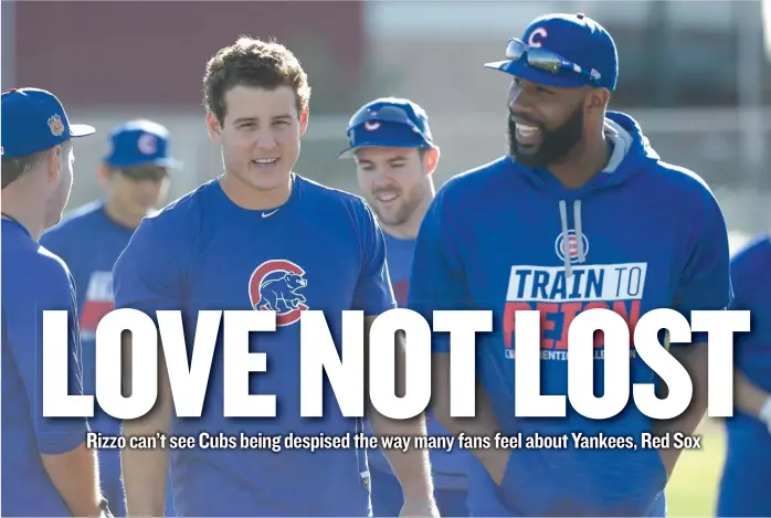  ??  ?? Jason Heyward talks to Anthony Rizzo during a spring- training workout Tuesday in Mesa, Ariz. Rizzo was told by a Red Sox and Patriots fan that the Cubs haven’t done anything until they’re hated across the country. | AP