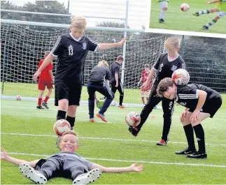  ??  ?? Ball work Youngsters show all ways to control the leather sphere