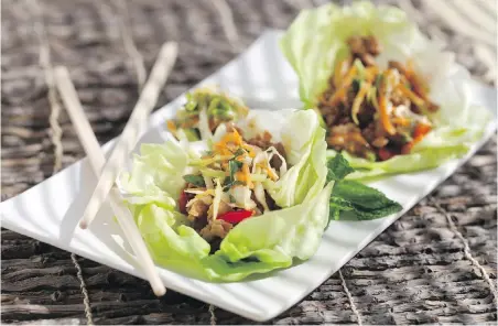  ?? JESSICA J. TREVINO, TRIBUNE NEWS SERVICE ?? Spicy Asian Lettuce Wraps serve four and can be made in 45 minutes.