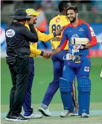  ?? Photo by M. Sajjad ?? imad Wasim from Karachi Kings is greeted after hitting the winning runs against Peshawar Zalmi. —