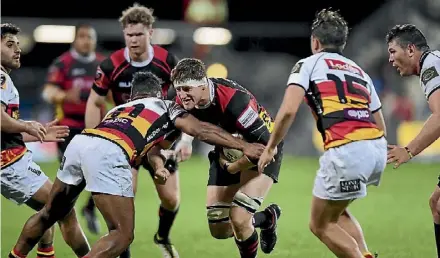  ??  ?? Canterbury loosie Tom Sanders charging at Waikato’s line.