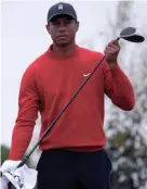  ?? ORLANDO RAMIREZ/USA TODAY SPORTS ?? Tiger Woods cleans the grip on his driver during the final round of the Farmers Insurance Open on Jan. 26.