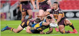  ?? SCOTT DAVIS THE ASSOCIATED PRESS ?? Parramatta’s Marata Niukore reaches out to score a try against Brisbane as the NRL resumes play.