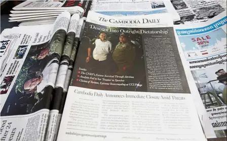  ?? — AP ?? Last edition: The final issue of ‘ The Cambodia Daily’ being sold at a news stand in Phnom Penh.