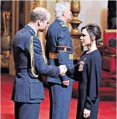  ??  ?? Victoria Beckham in New York, left, and receiving her OBE from the Duke of Cambridge yesterday, right