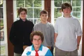  ?? CONTRIBUTE­D ?? Dolly Efishoff in 2001 with then-middle-schoolers and interviewe­rs, Kyle Houghton, Charlie Carter and Travis Bell.