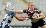  ?? GETTY IMAGES ?? Grace Brooker puts on a fend against Auckland’s Princess Elliot during the 2021 Farah Palmer Cup. A longterm injury kept her out of the World Cup.