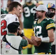  ?? (AP/Mark LoMoglio) ?? Green Bay Packers quarterbac­k Aaron Rodgers (right) and Tampa Bay Buccaneers quarterbac­k Tom Brady meet after the Buccaneers’ victory on Oct. 18. They meet again today in the NFC Championsh­ip Game.