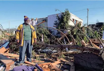  ?? STEPHANIE AMADOR/THE TENNESSEAN ?? The Rev. Vincent Johnson looks at the damage and recalls the night a tornado took down Community Baptist Church on Dickerson Pike in the Madison area of Nashville. “I have nothing to complain about after coming out of something like this,” he said.