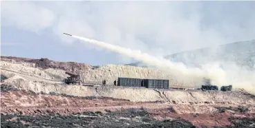  ?? AP ?? Turkish artillery fires toward Syrian Kurdish positions in Afrin area, Syria, from the Turkish side of the border in Hatay, Turkey, on Feb 9.