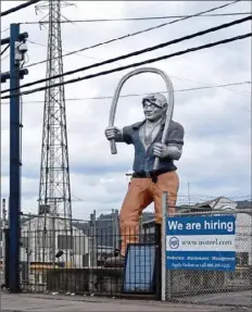  ?? Daniel Moore/Post-Gazette ?? The statue at the entrance to the U.S. Steel Mon Valley Works’ Edgar Thomson plant in Braddock.