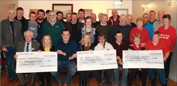  ??  ?? Organisers of the Garden County Country Festival, in conjunctio­n with Carnew Heritage Day, presented cheques to local charities – Carnew Community Care, St Aidan’s Centre and Friends of Local People with MS – in Kenny’s Carnew. Front row: Pat Brennan, Yvonne Edwards, Martin Austin, Maura Kelly, Katie McEvoy, Kevin McEvoy, Ann Fortune and Mary O’Rourke.