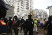  ?? (AP/Sunday Alamba) ?? Rescuers work Monday at the site of the collapsed apartment building in Lagos, Nigeria.