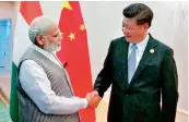  ?? — PTI ?? PM Narendra Modi shakes hands with Chinese President Xi Jinping during a meeting in Tashkent on Thursday on the sidelines of SCO Summit.