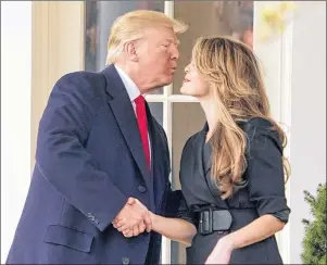  ?? AP PHOTO ?? President Donald Trump kisses White House communicat­ions director Hope Hicks on her last day before he boards Marine One on the South Lawn of the White House in Washington, Thursday for a short trip to Andrews Air Force Base, Md., and then on to...