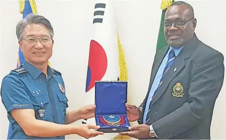  ?? Photo: Police Media Cell ?? Fiji Police Chief of Operations Officer Assistant Commission­er Tudravu (left), paid a courtesy call to the Chief of Police Kim Sang-Gu of the Gimhae-Jungbu Station in South Korea and was briefed on the Police operations in Busan.