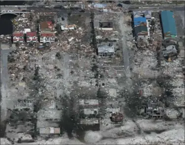  ?? MICHAEL SNYDER/ NORTHWEST FLORIDA DAILY NEWS VIA AP ?? An entire neighborho­od between 40th Street and 42nd Street in Mexico Beach, Fla. was wiped out by Hurricane Michael, Thursday, Oct. 11, 2018. The devastatio­n inflicted by Hurricane Michael came into focus Thursday with rows upon rows of homes found smashed to pieces, and rescue crews began making their way into the stricken areas in hopes of accounting for hundreds of people who may have stayed behind.