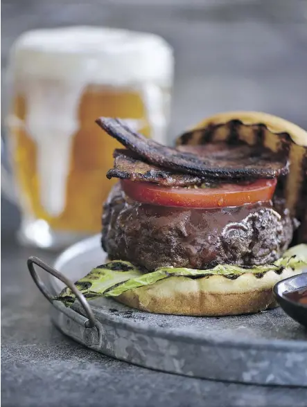  ?? PHOTOS: MATTHEW BENSON ?? “There’s a lot to love — literally — because each burger tips the scale at 8 ounces,” Steven Raichlen writes of his barbecue burgers, which he makes with a sauce and rub also found in his cookbook.
