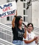  ??  ?? Protest organizers Khloe Liscano, left, and Olivia Quintero address the demonstrat­ors at the abortion rights rally Sunday at City Hall.