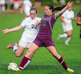  ?? SARAH GORDON/THE DAY ?? Wheeler’s Emma Morgan (13) steps in to defend against Ledyard’s Stefie Sieling during Saturday’s game at Blonders Park in Ledyard, where the Colonels won 7-0. Visit www.theday.com to view a photo gallery.