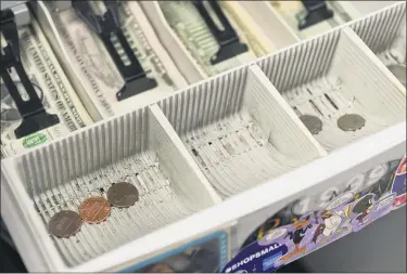  ?? BEN HASTY — MEDIANEWS GROUP ?? The cash register drawer at Symbiote Collectibl­es in West Reading is proof of a coin shortage in the U.S. during the coronaviru­s pandemic.