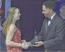  ??  ?? Briarcrest senior Alyssa Neuberger accepts the award for female scholar athlete of the year from The Commercial Appeal’s Jason Smith during Friday’s Pepsi Best of the Preps ceremony.