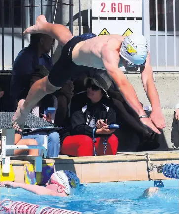  ??  ?? Fine form: Benalla’s Charles Moll dives in during a recent club swim meet in Benalla.
