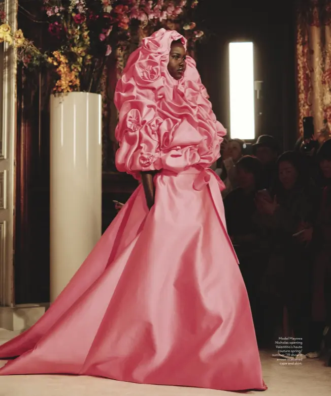  ??  ?? Model Mayowa Nicholas opening Valentino’s haute couture spring/ summer ’19 show in a rose-scattered cape and skirt.