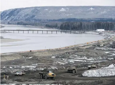  ??  ?? The Site C dam along the Peace River near Fort St. John is under constructi­on in this April photo.