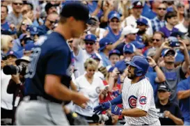  ?? JIM YOUNG / ASSOCIATED PRESS ?? Rene Rivera rounds the bases after hitting a grand slam against Braves rookie pitcher Lucas Sims in the Cubs’ 14-12 romp at blustery Wrigley Field.