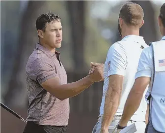  ?? AP PHOTO ?? BIG GUNS: Brooks Koepka (left) shakes hands with Dustin Johnson after they completed the second round of the Northern Trust yesterday at Ridgewood Country Club in Paramus, N.J.