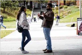  ?? ALYSSA POINTER/ATLANTA JOURNAL CONSTITUTI­ON ?? Pro-life group Created Equal arrived Monday at Georgia Tech to demonstrat­e, wearing body cameras while talking to students, and displaying images of fetuses.