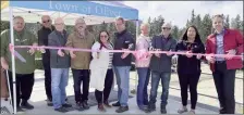  ?? ?? Local officials cut the ribbon to mark completion of an 11.5-million repair to Oliver’s agricultur­al water system.