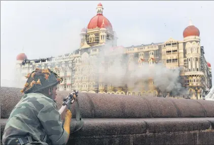  ?? PEDRO UGARTE/ AFP ?? The stuff of nightmares: Taj Mahal Hotel in Mumbai on November 29, 2008