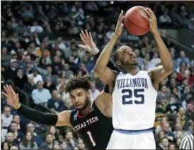  ?? CHARLES KRUPA — THE ASSOCIATED PRESS ?? Villanova’s Mikal Bridges, right, grabs a rebound in front of Texas Tech’s Brandone Francis during the first half of the East Regional final Sunday in Boston.