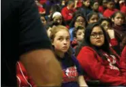  ?? MARTHA IRVINE — THE ASSOCIATED PRESS ?? Students listen to a presentati­on given by Rich Wistocki, a retired cybercrime detective, at Nathan Hale Elementary School in Chicago on Friday. Among other things, he gives them advice on how to stay safe on social media. Many kids at the K-8 school said they have social media and a good number said their parents either don’t know that or don’t know what they do with the accounts.