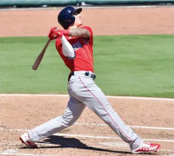  ?? GETTY IMAGES; LEFT, AP ?? ATTENTION-GRABBER: Red Sox outfielder Jarren Duran hits a home run and rounds the bases, left, against the Orioles on Thursday in Sarasota, Fla.