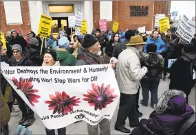  ?? Peter Hvizdak / Hearst Connecticu­t Media file photo ?? Activists demonstrat­e in front of the Wells Fargo bank branch on the corner of College and Elm streets in New Haven in January 2017 to show anger over the bank’s funding of and President Donald Trump’s support for the Dakota pipeline.