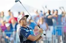  ?? WILFREDO LEE/AP ?? Rickie Fowler watches his tee shot on the 17th hole during the third round of the Honda Classic on Saturday in Palm Beach Gardens.