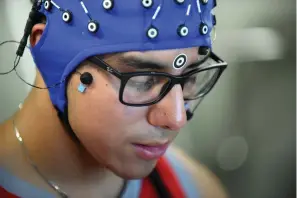  ?? Associated Press ?? ■ Jack Rodriguez, a student at Texas State University and a stutterer all of his life, participat­es in a study at UTSA that uses electrodes to pick up signals to graph what his brain is doing when he is speaking fluently.