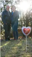  ?? STACEY WESCOTT / CHICAGO TRIBUNE PHOTOS ?? Joe and Laurel Dubowski in their backyard with a heart balloon that they bought for their daughter Gayle on Friday in Carol Stream. On Tuesday, they will take this balloon and place it at her memorial outside of Cole Hall at Northern Illinois University. Gayle was one of five students killed in a mass shooting in 2008.