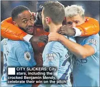  ??  ?? CITY SLICKERS: City stars, including the crocked Benjamin Mendy, celebrate their win on the pitch